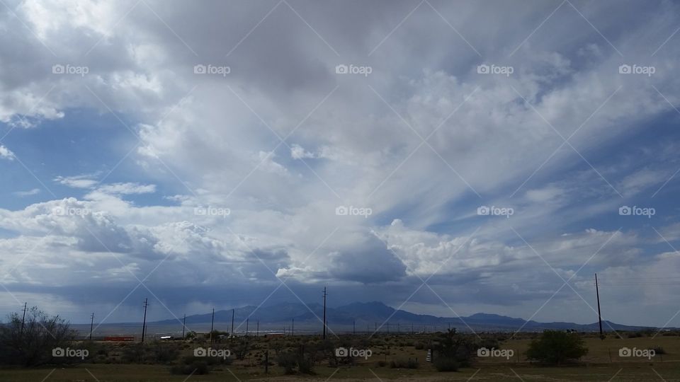 Clouds over the desert and mountain.