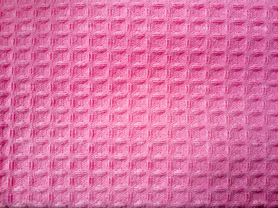 Pink fabric woven in squares and long rectangles