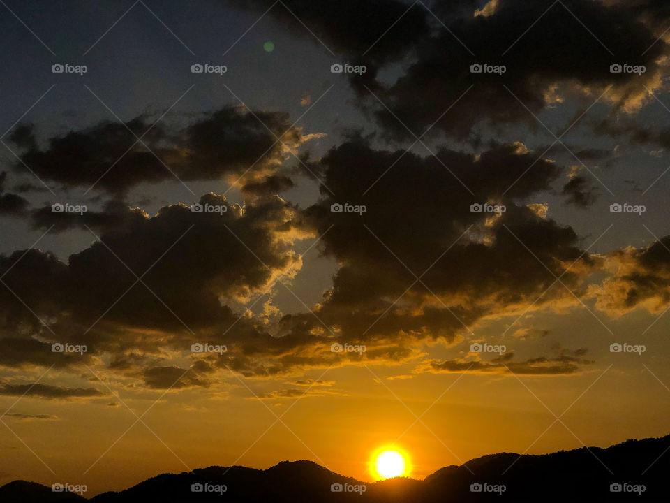 Late evening sunset with yellow sky