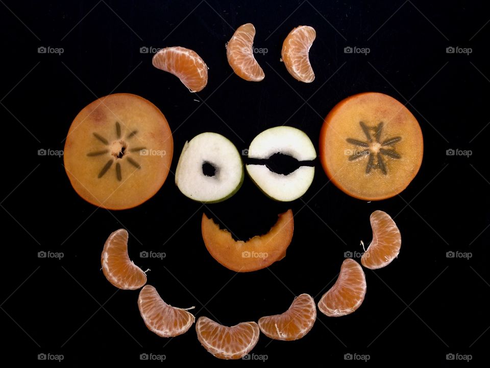 Funny face made with fruits 