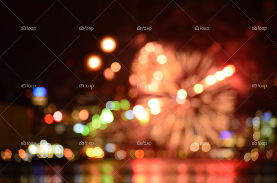 blurred focus firework celebration over harbour
