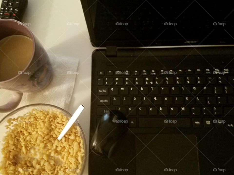 hot coffee, cereal, computer in the morning