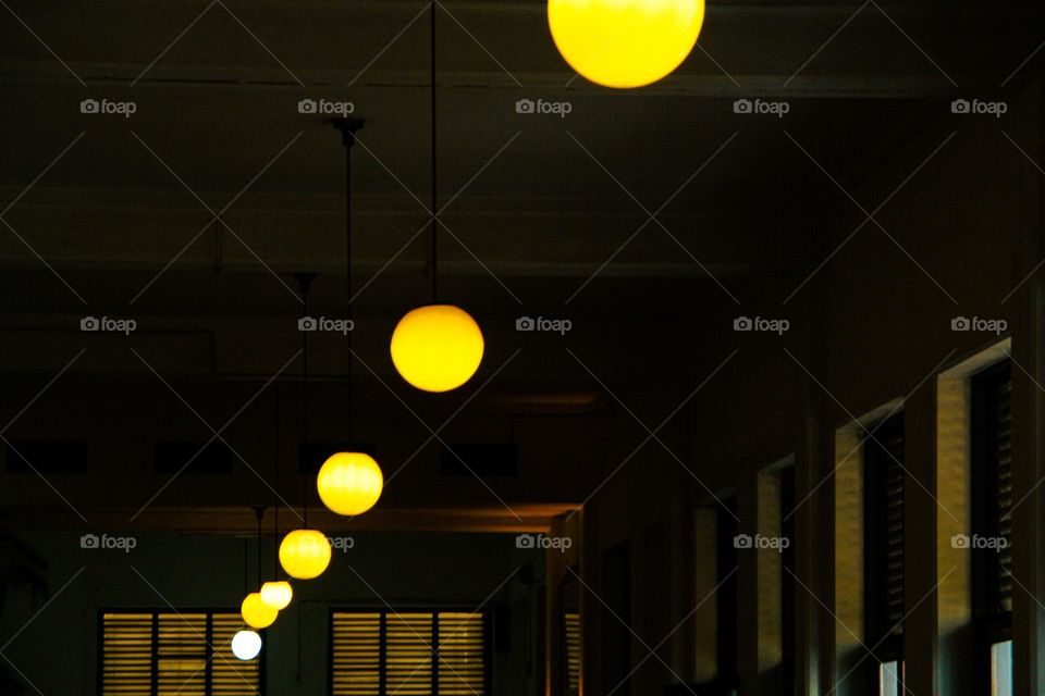 Portrait of a classic style indoor chandelier with many lights arranged upwards, the chandelier is suitable for the interior of a living room or family room.