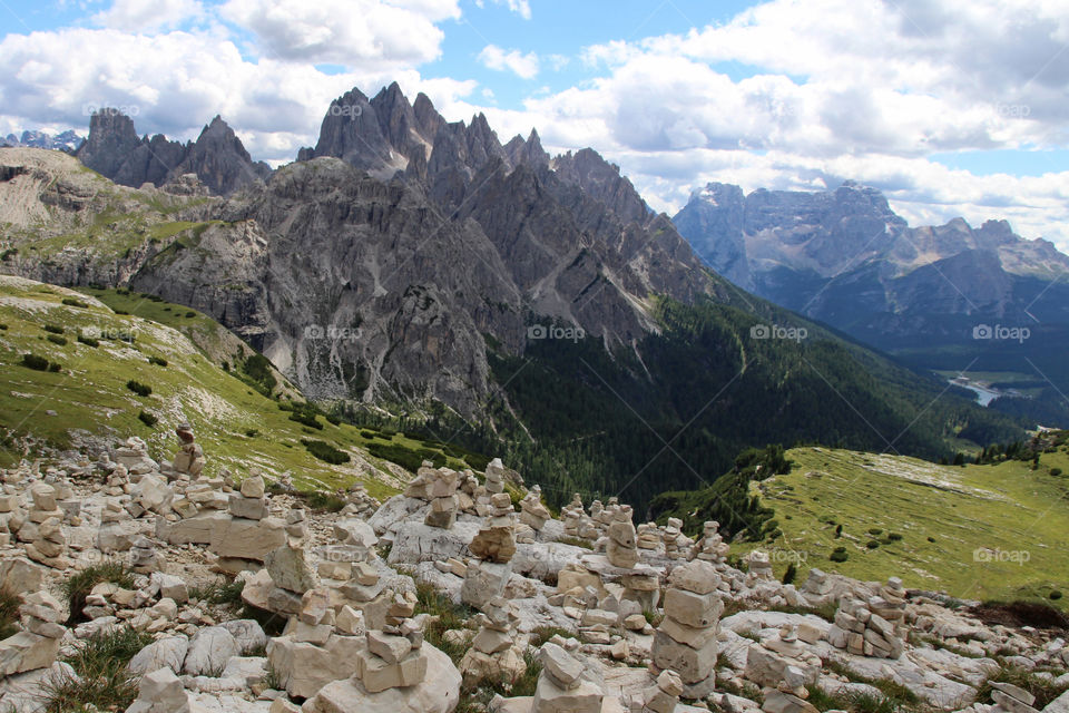 Stacked stones, view of high mountain peaks 