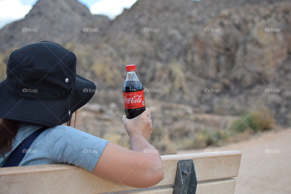 Taking a break from hiking with coke 