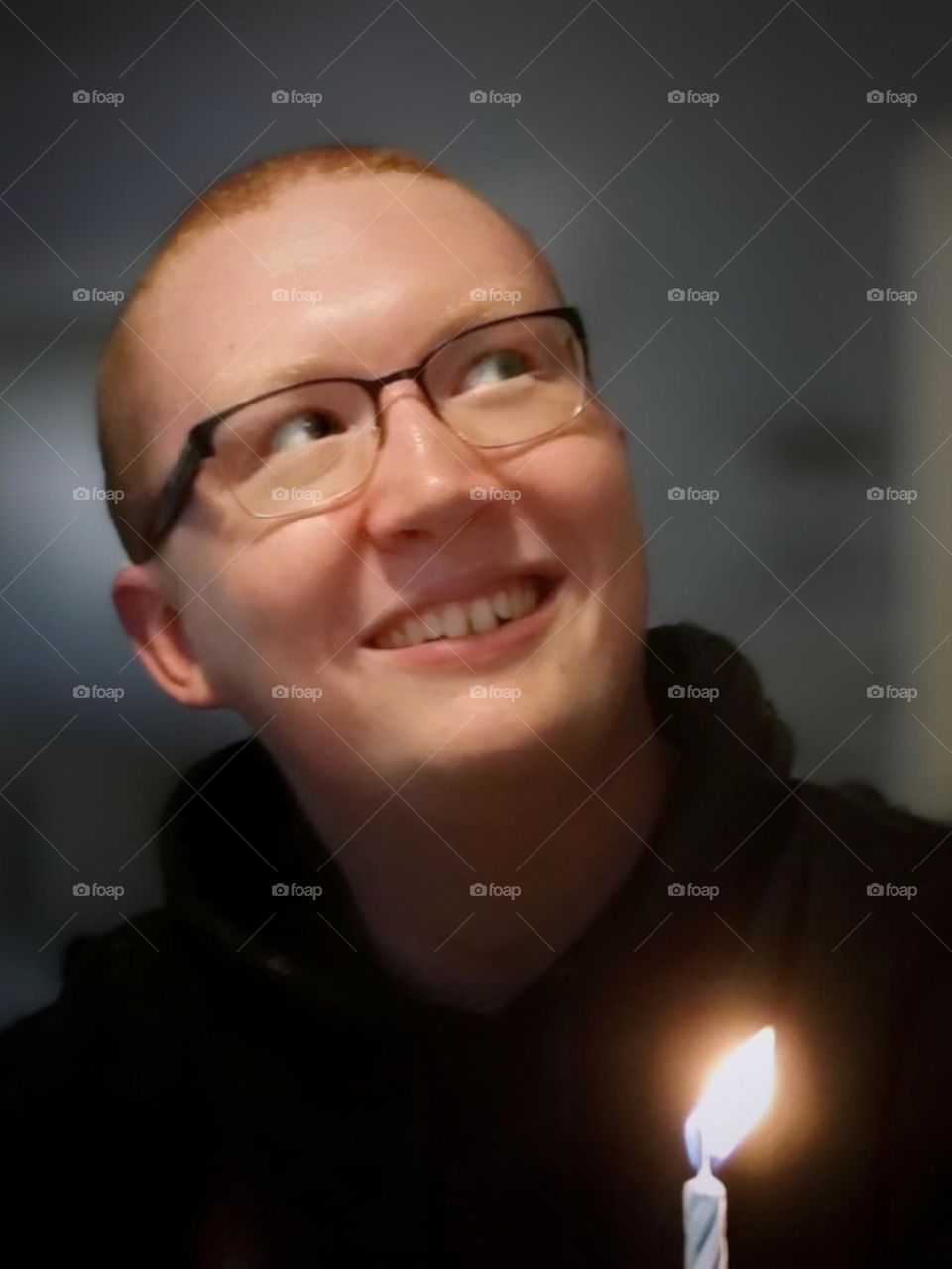 Young Man Smiling Looking Up