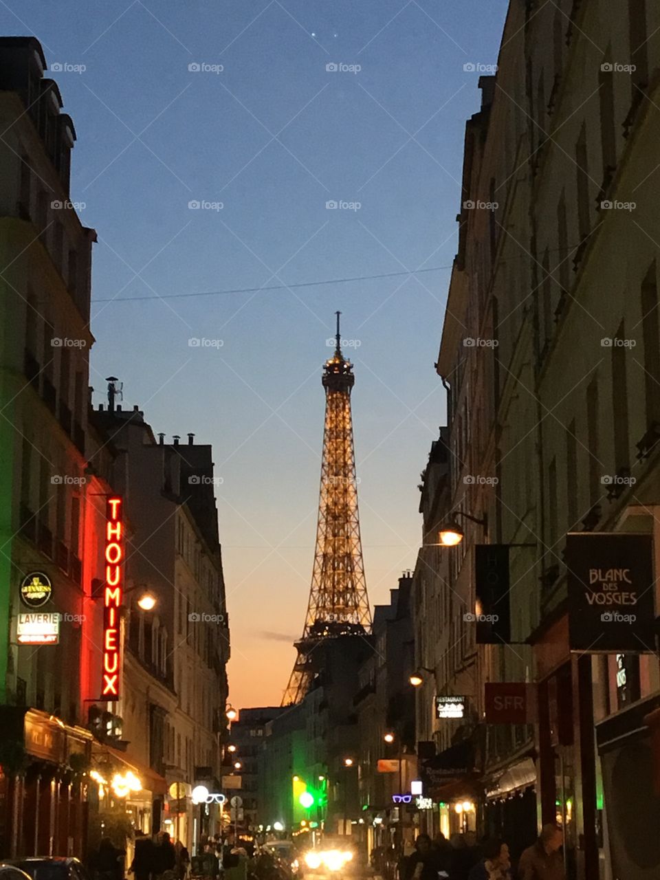 Looking at the Eiffel Tower from the street and through the buildings