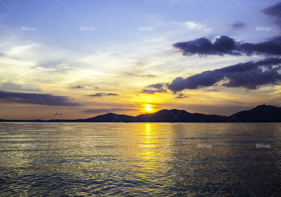 Sunset with mountain on seascape