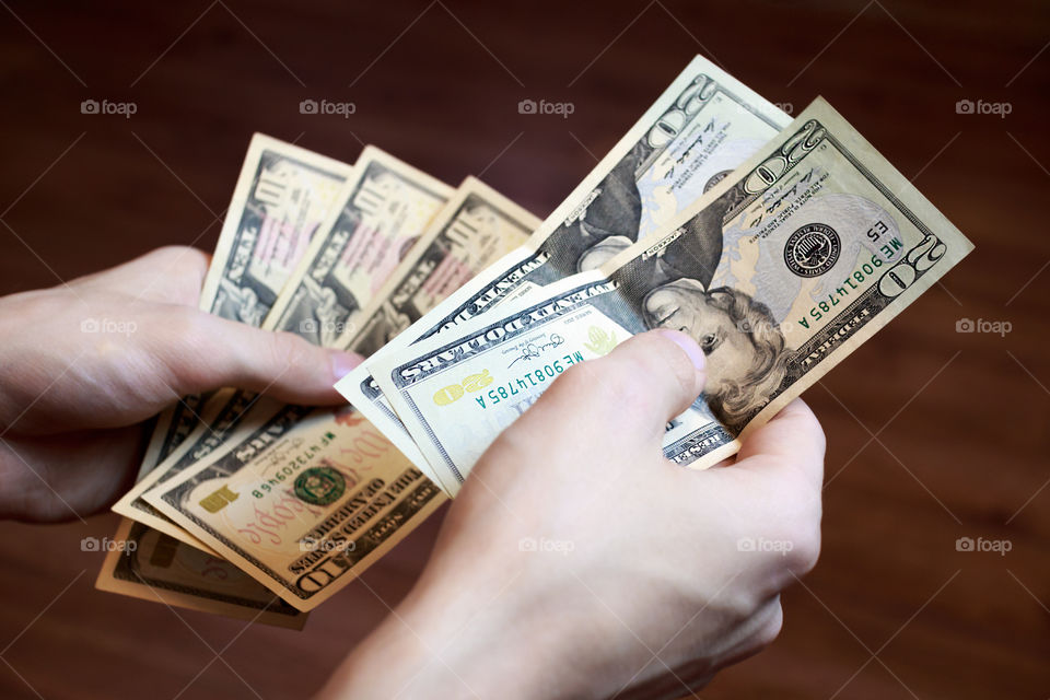 Close-up of person's holding banknote