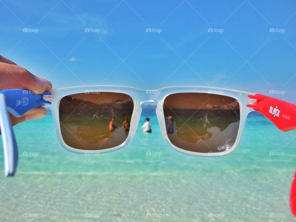 Sunglasses and sea