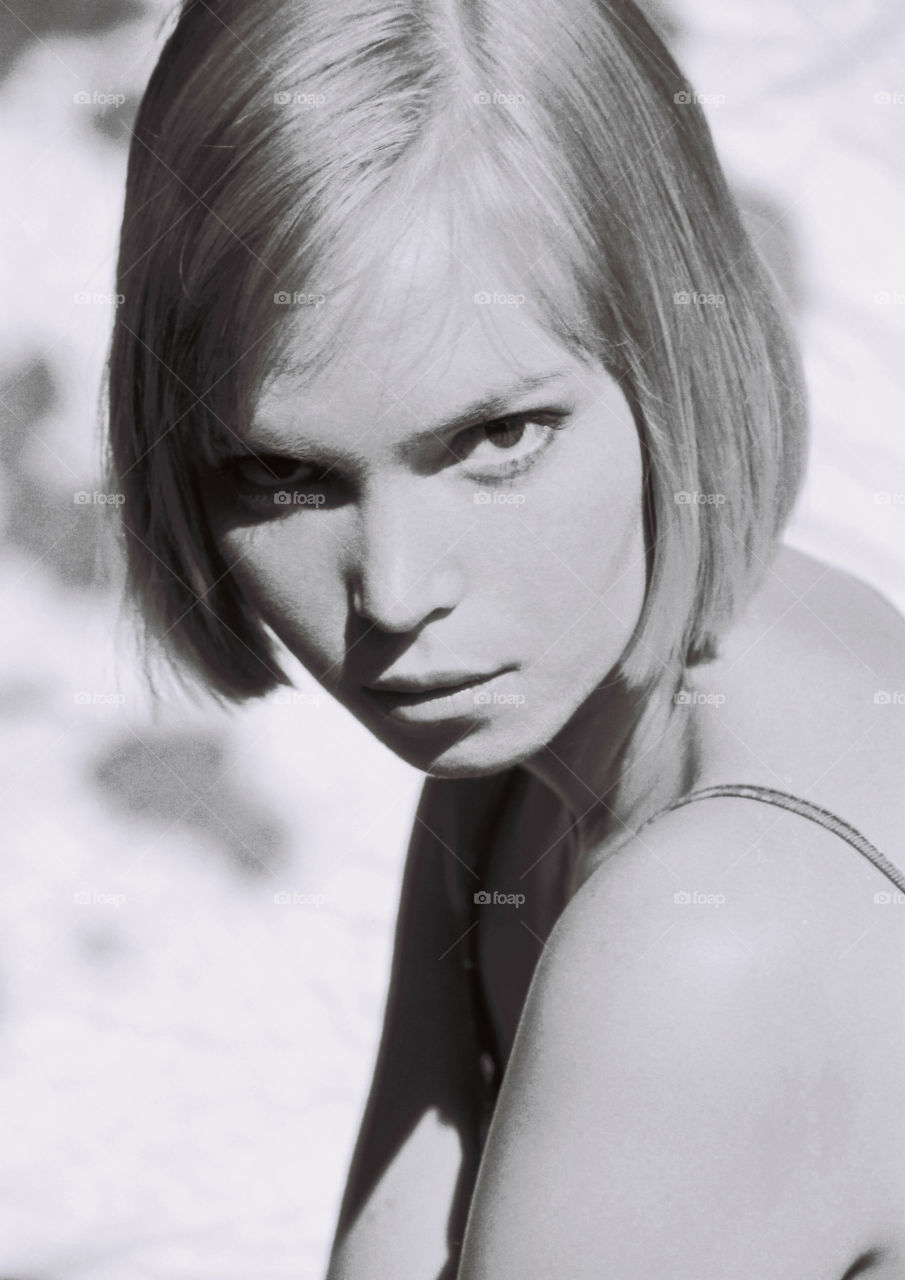 blackandwhite portrait of a blonde girl . blonde young woman looking sharp, black and white retro photography