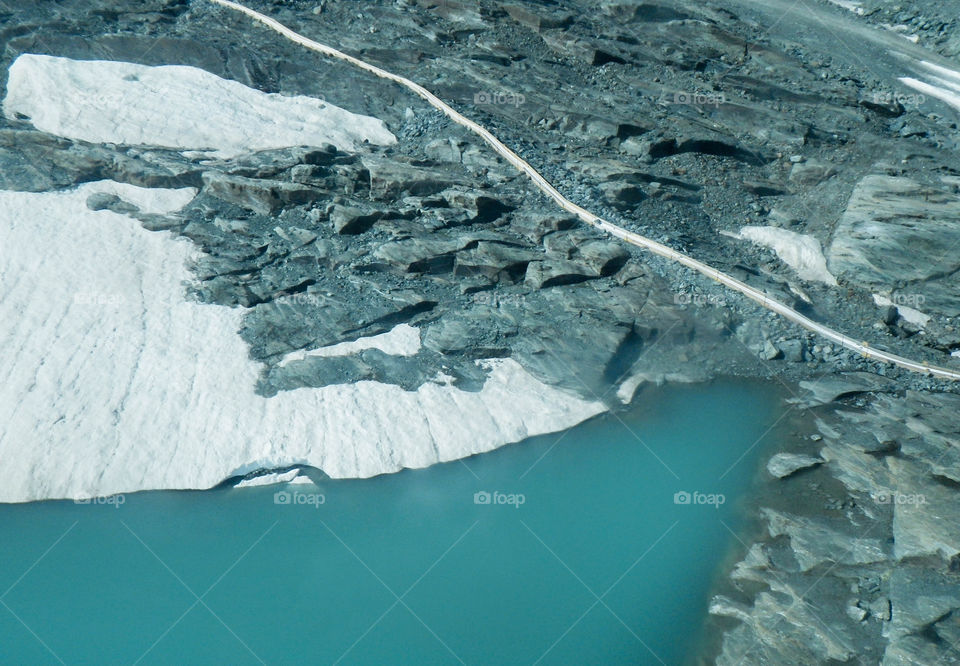 Water, road and rocks, view from above