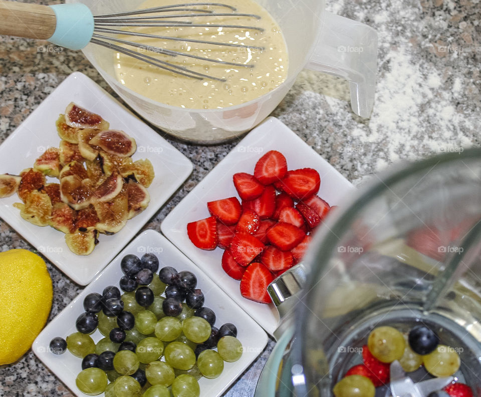 Making pancakes, with a fresh, fruity sauce