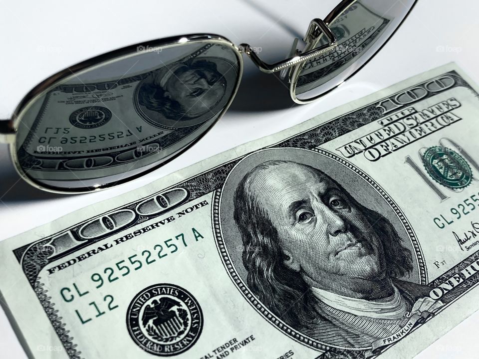 reflection of the bill in sunglasses