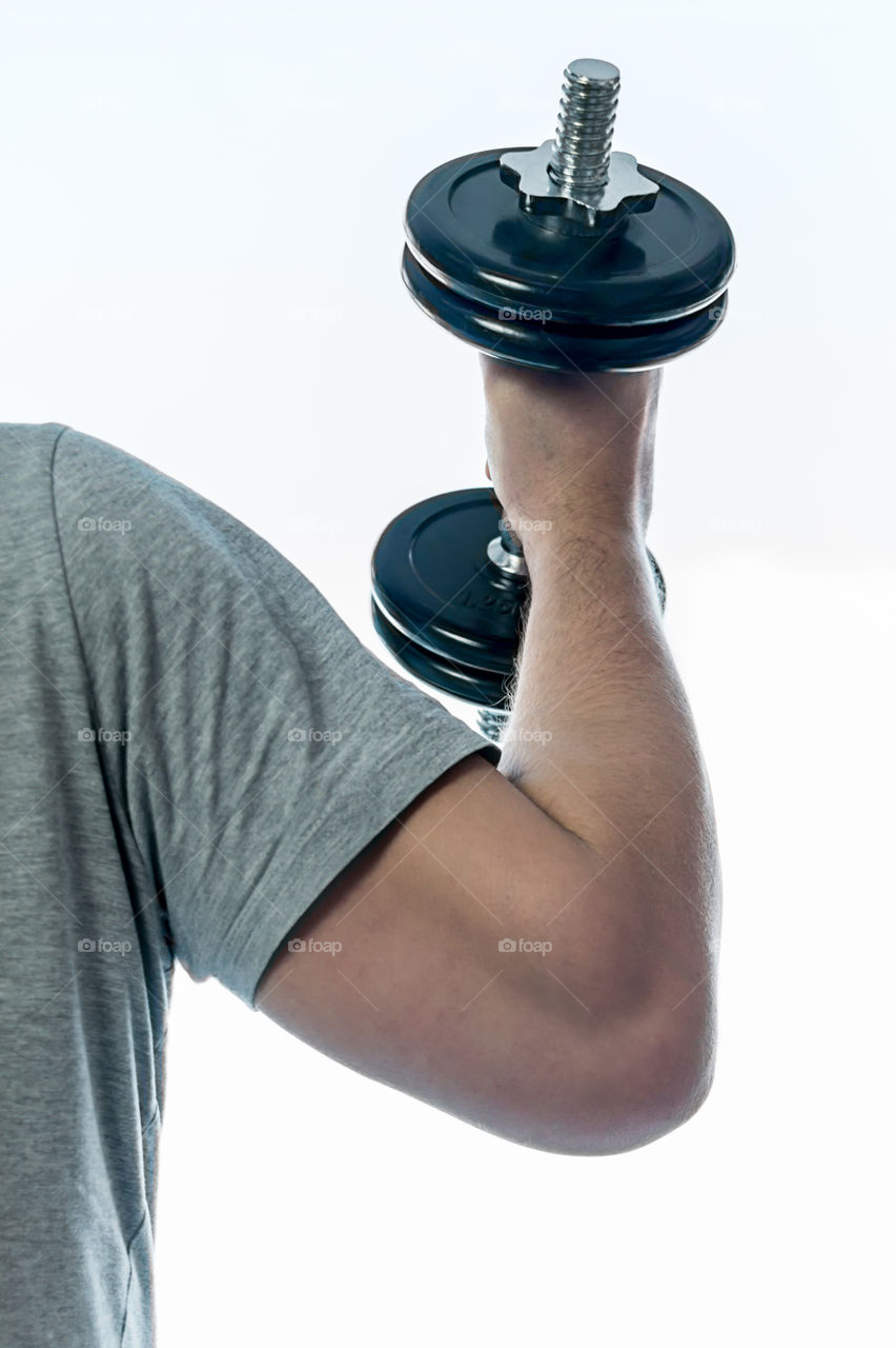 man with dumbbells doing exercises