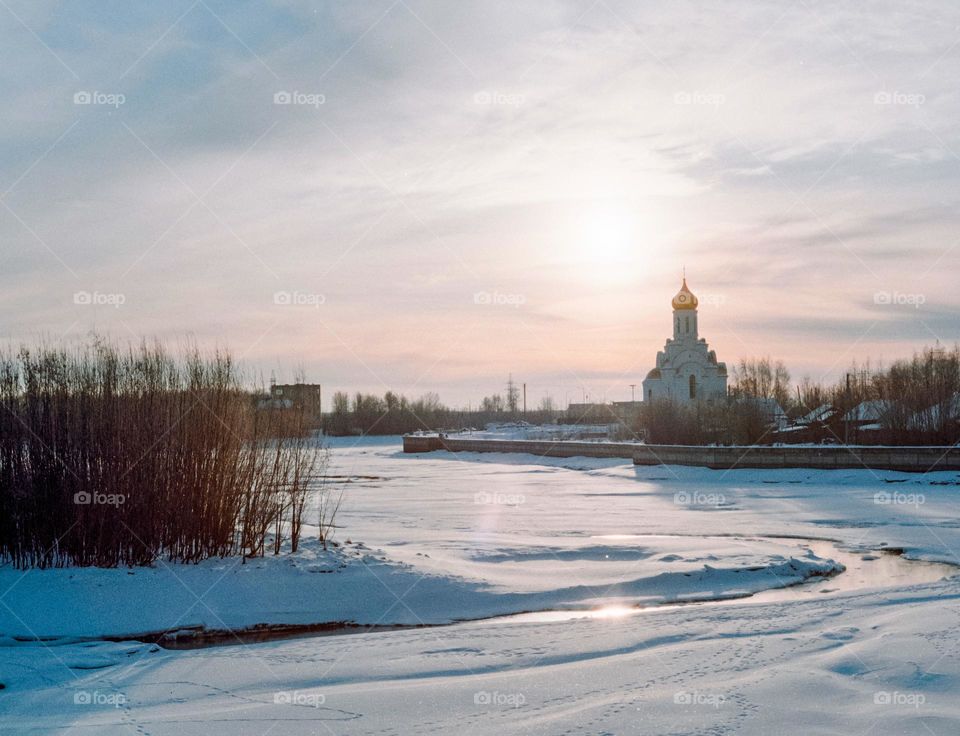 Church at dawn, winter landscape 
