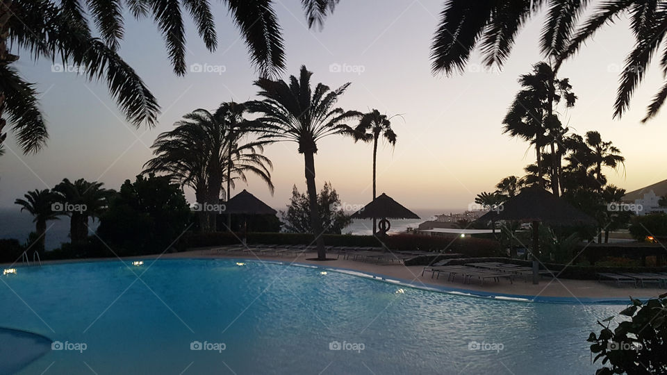 Sunset by the pool and beach 