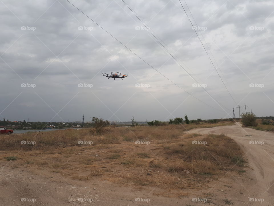 The drone flying under the fields