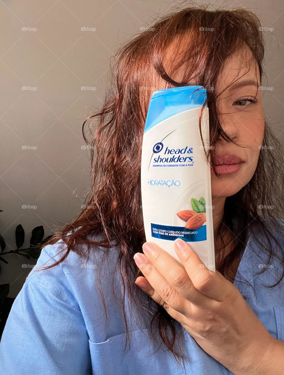 Woman showing shampoo