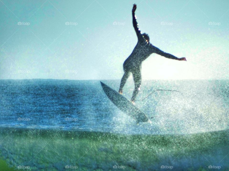 Epic Surfer Defying Gravity. Big Wave Surfing
