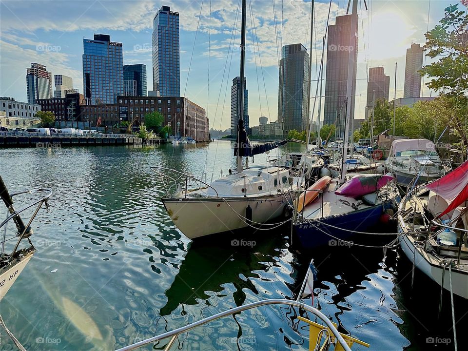 This is beautiful “Newtown Creek” with its great variety of boats seen from aboard “Salvation”, a “28 ft 1969 Luhrs” cabin cruiser by the “Pulaski Bridge” in LIC, Queens on a warm sunny evening in May 2024. Hypnotic Productions