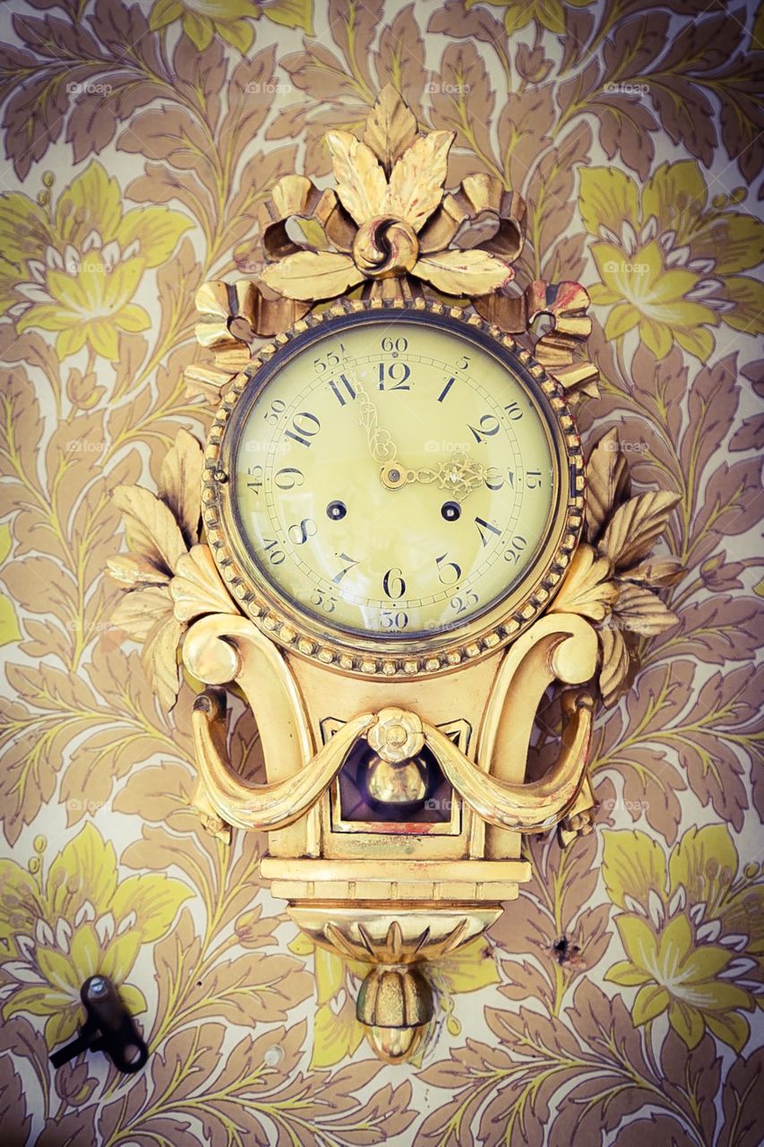 Antique clock. Golden antique clock
