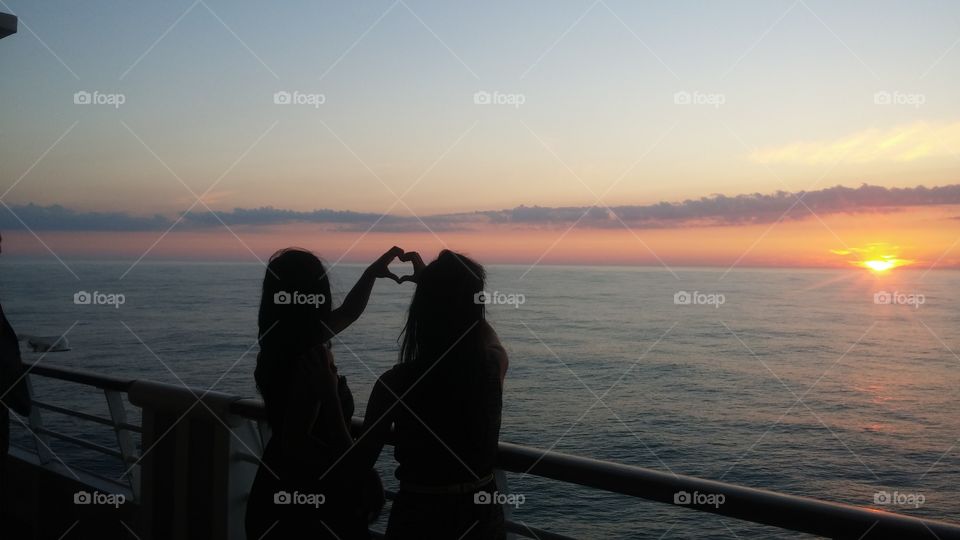 Two girls in love with a beautiful sunset!