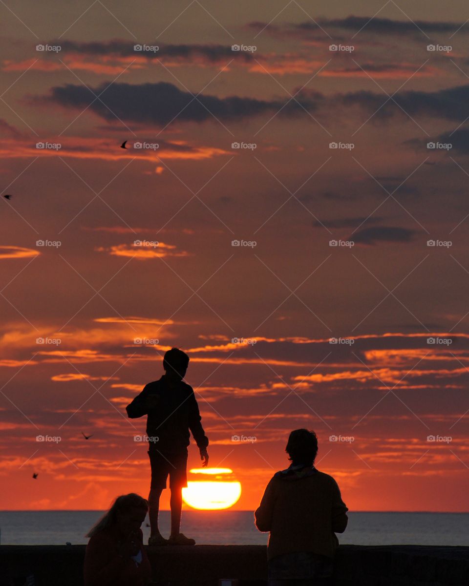 Silhouette of people during sunset