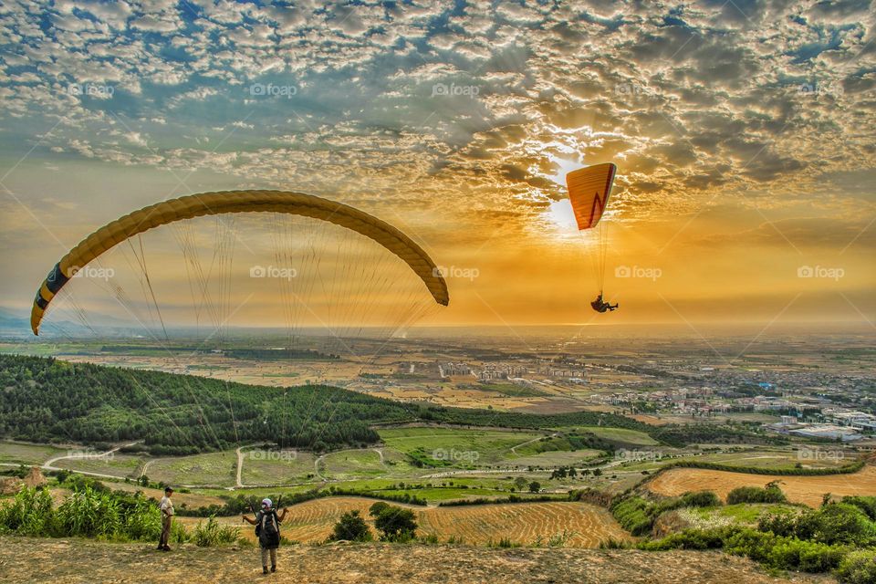Sunset and paragliding
