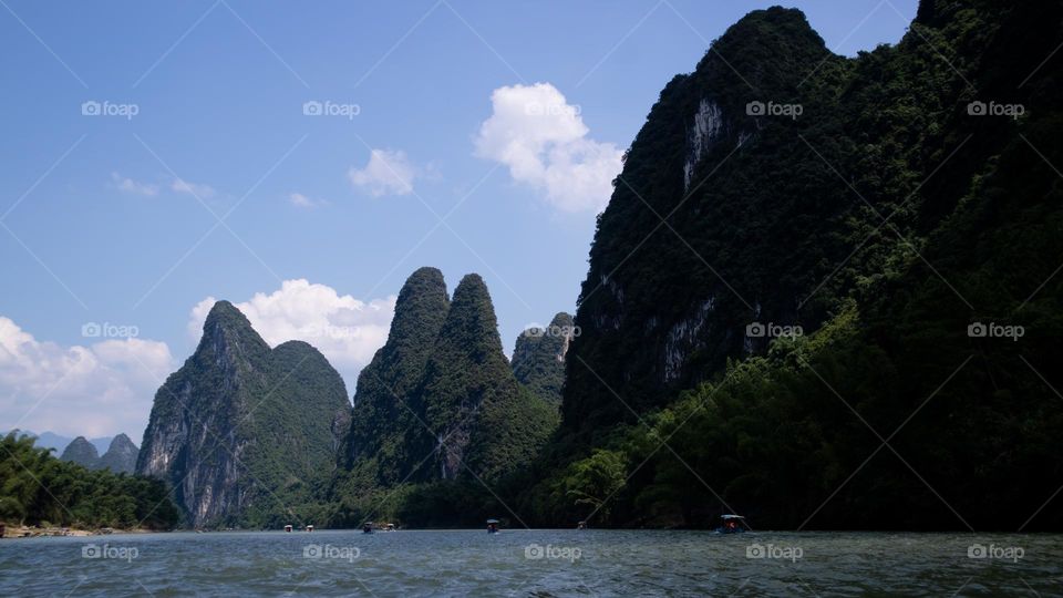 Image of a river with mountains in the background