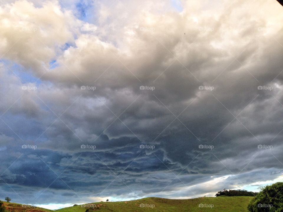 View of hill against cloudy sky