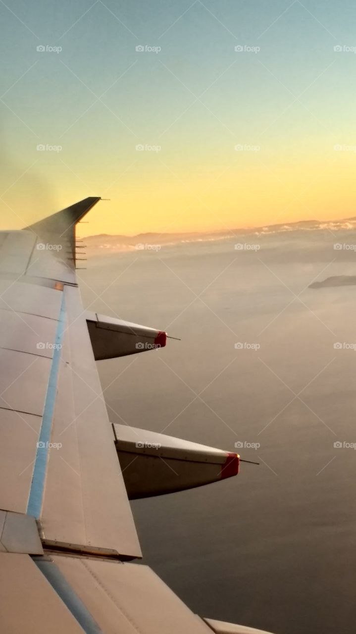 view of a sunset out of a planes window