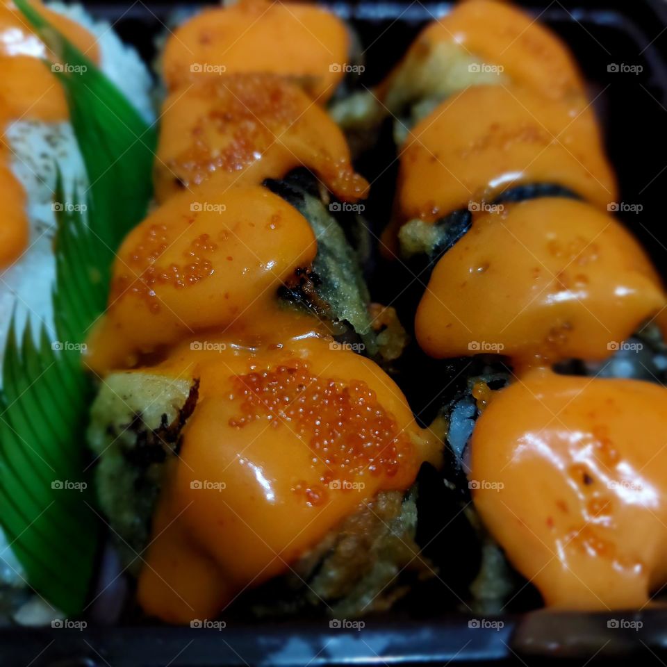 assorted sushi served in a container