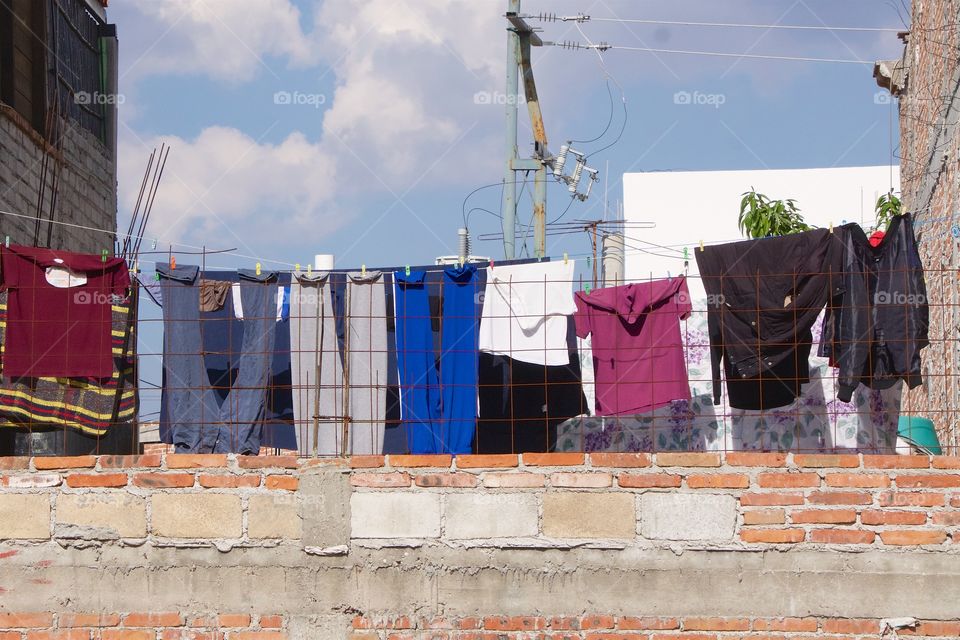 Family laundry being aired on a roof clothesline in San Miguel de Allende, Mexico