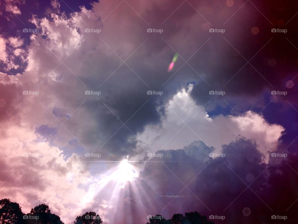 Solar flash on indigo skies. Great Sky colors With sunrays