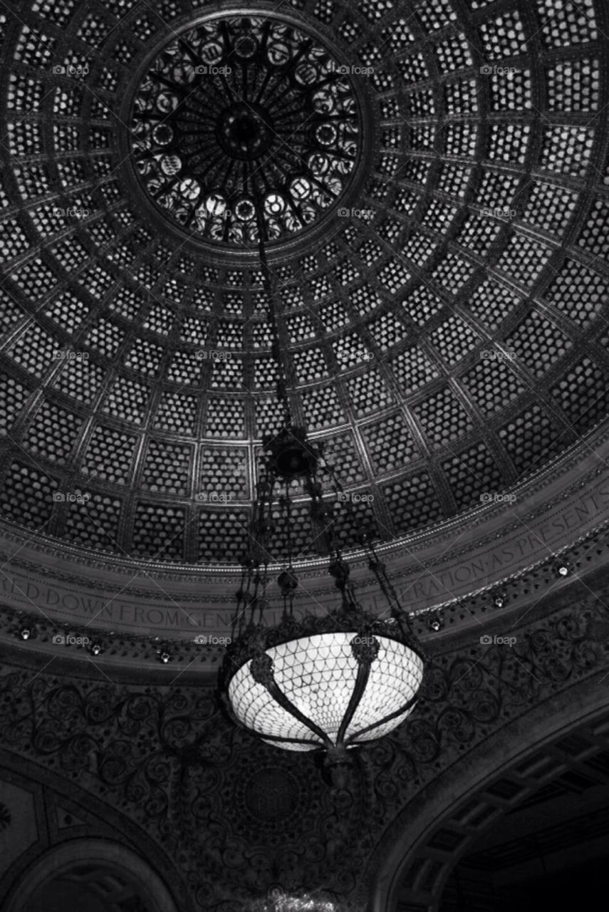 B & W Architecture. Ceiling in a building in Chicago , with light hanging down .