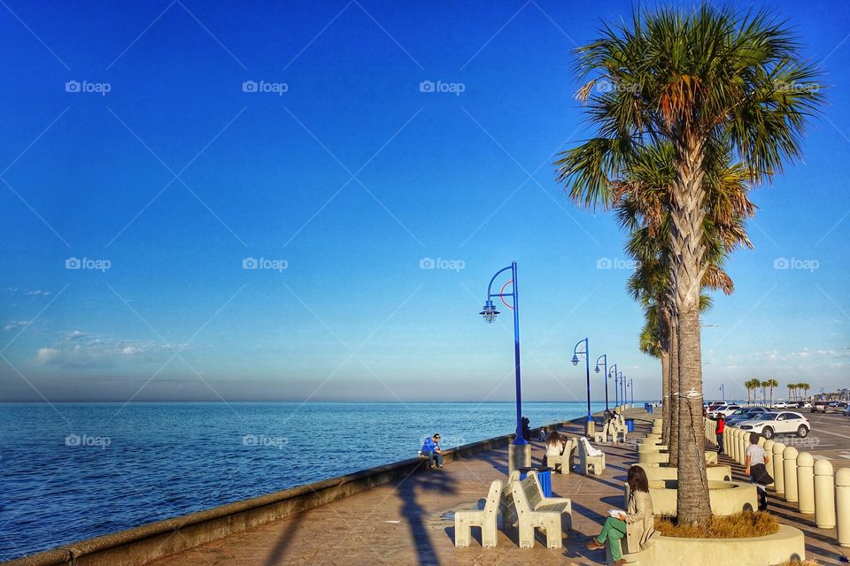 Pedestrian walkway along Lake Pontchartrain, New Orleans, USA. An idyllic afternoon view.