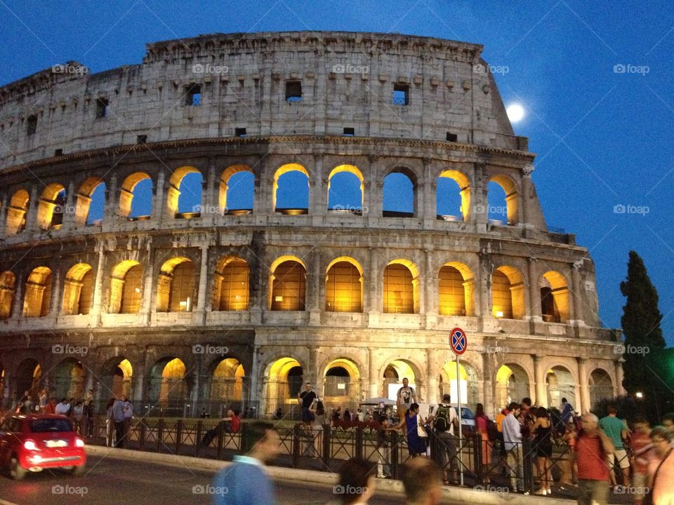 The Roman coliseum lit up at night