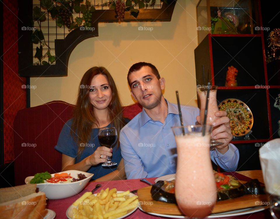 Woman and man dining at restaurant