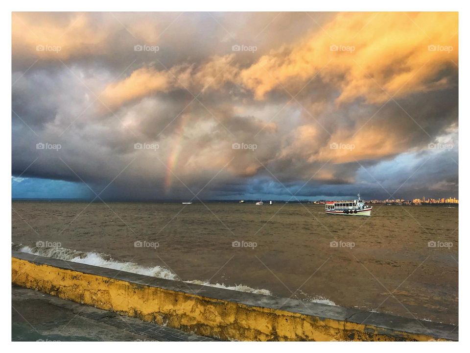 orange clouds in the late afternoon on the island of Itaparica, in Vera Cruz, Bahia, Brazil