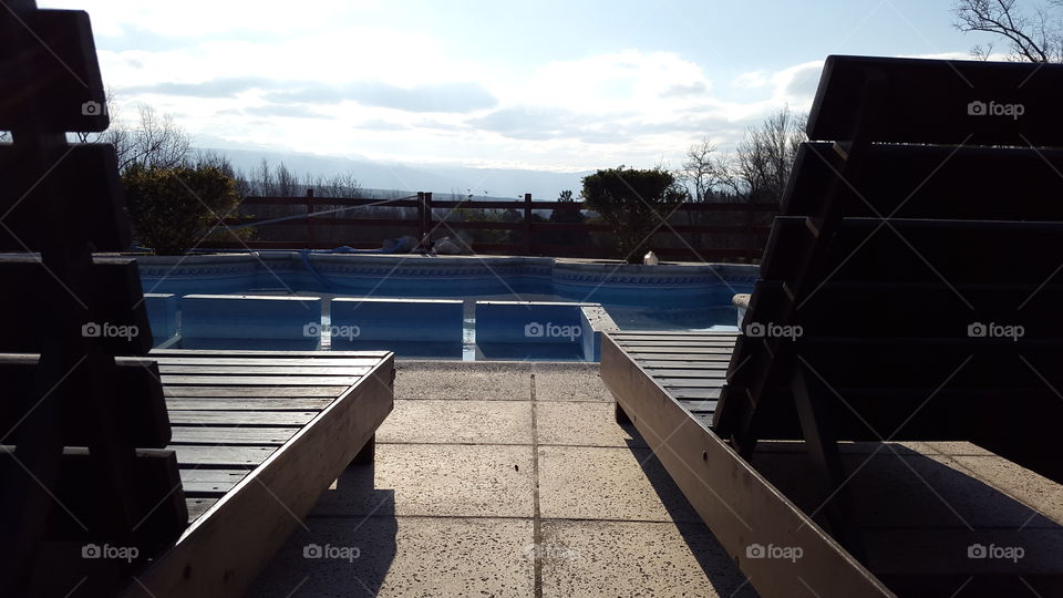 swiming pool. chairs at swiming pool