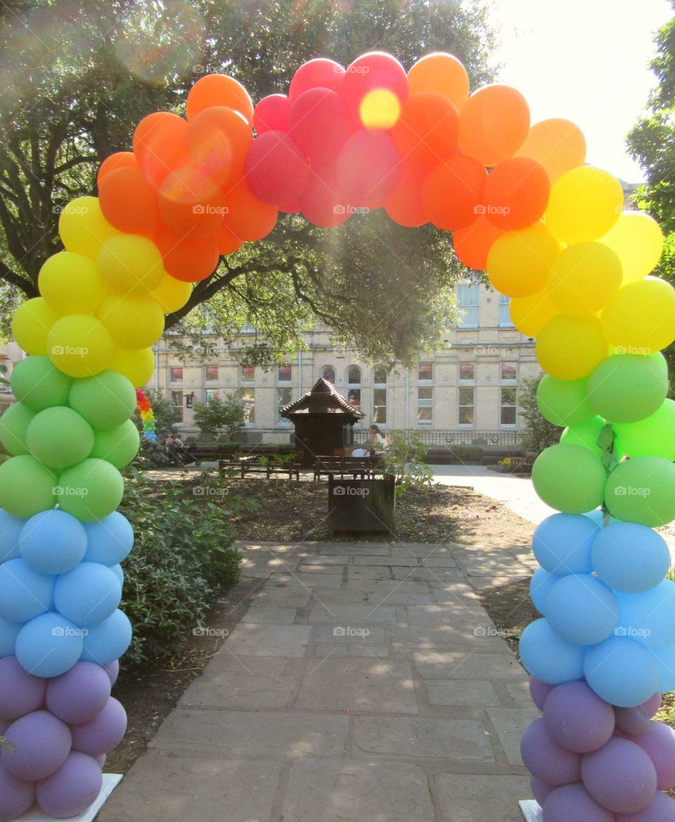 Archway made of rainbow colour balloons. Display made for pride taken at Cardiff wales
