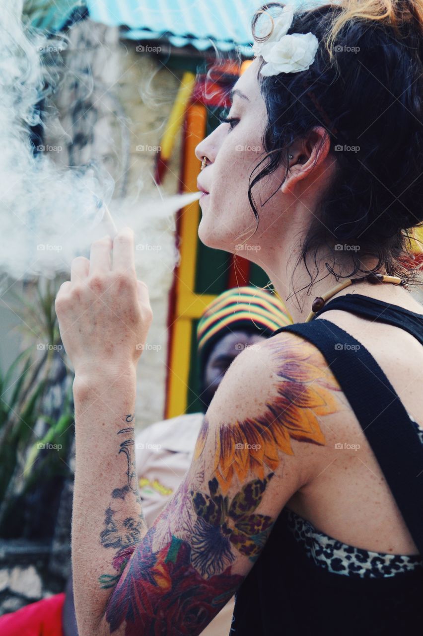 Side view of a woman smoking