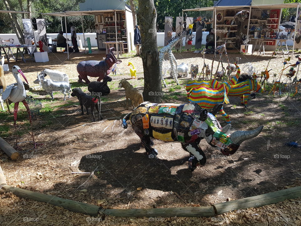 african art in south africa in a wine estate statues made of tin and cand recyled