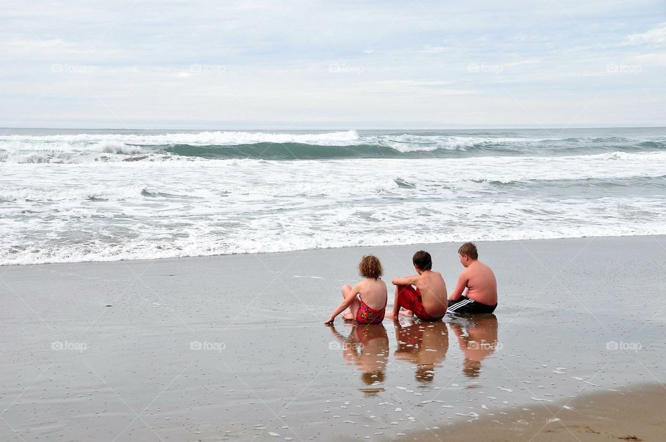 Watching waves with cousins in Oregon shore. 