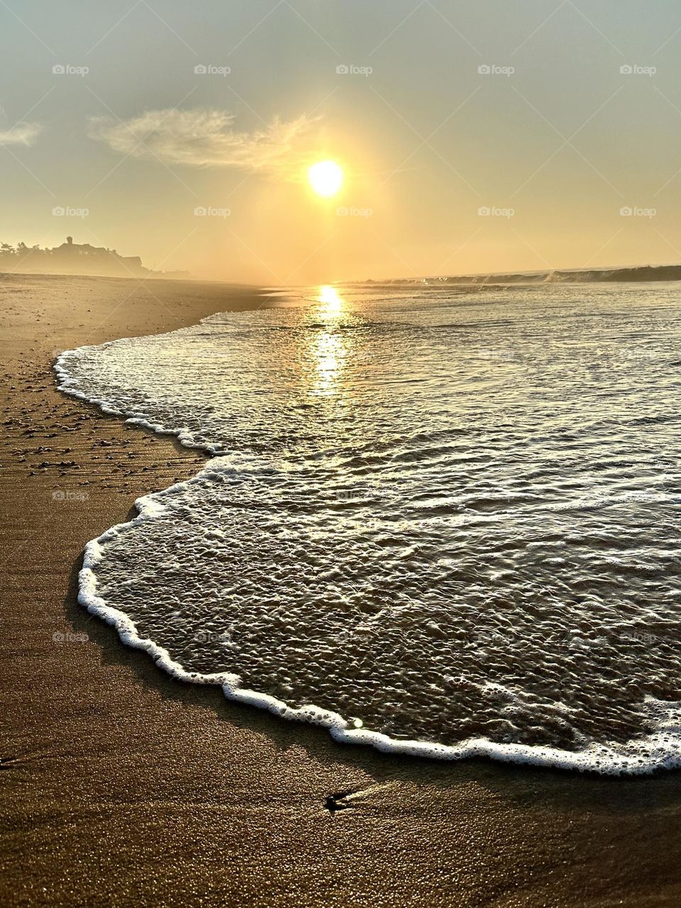 Walking on the beach, beach scene, water washing up on the shoreline, morning sun on the beach, serene beach scenes, relaxing at the beach 