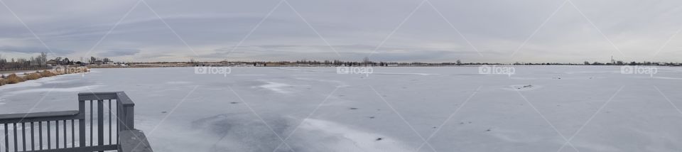 Gorgeous panoramic view of Windsor Lake, Colorado in the Winter after the first freeze of the season. Brrrr!