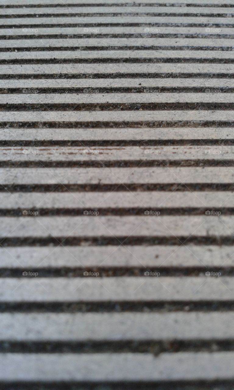 close-up at an angle of the slats on a picnic table