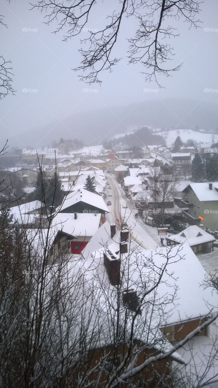 Winter in Austria. Snow fall in a small city village in austria. Photo was taken from hotel window