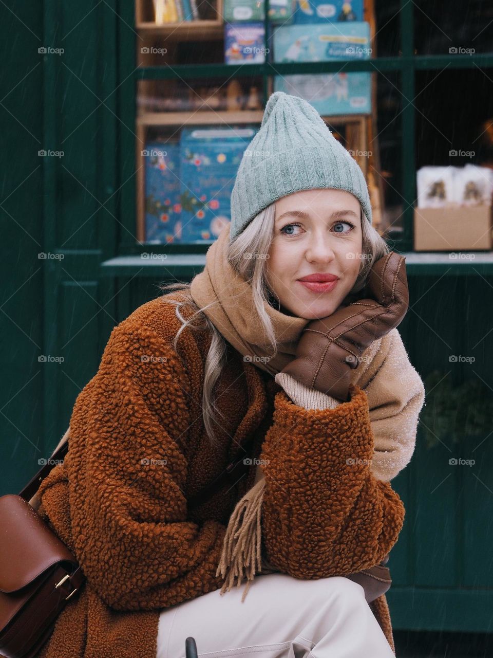 Portrait of young beautiful blonde woman on a Christmas market 